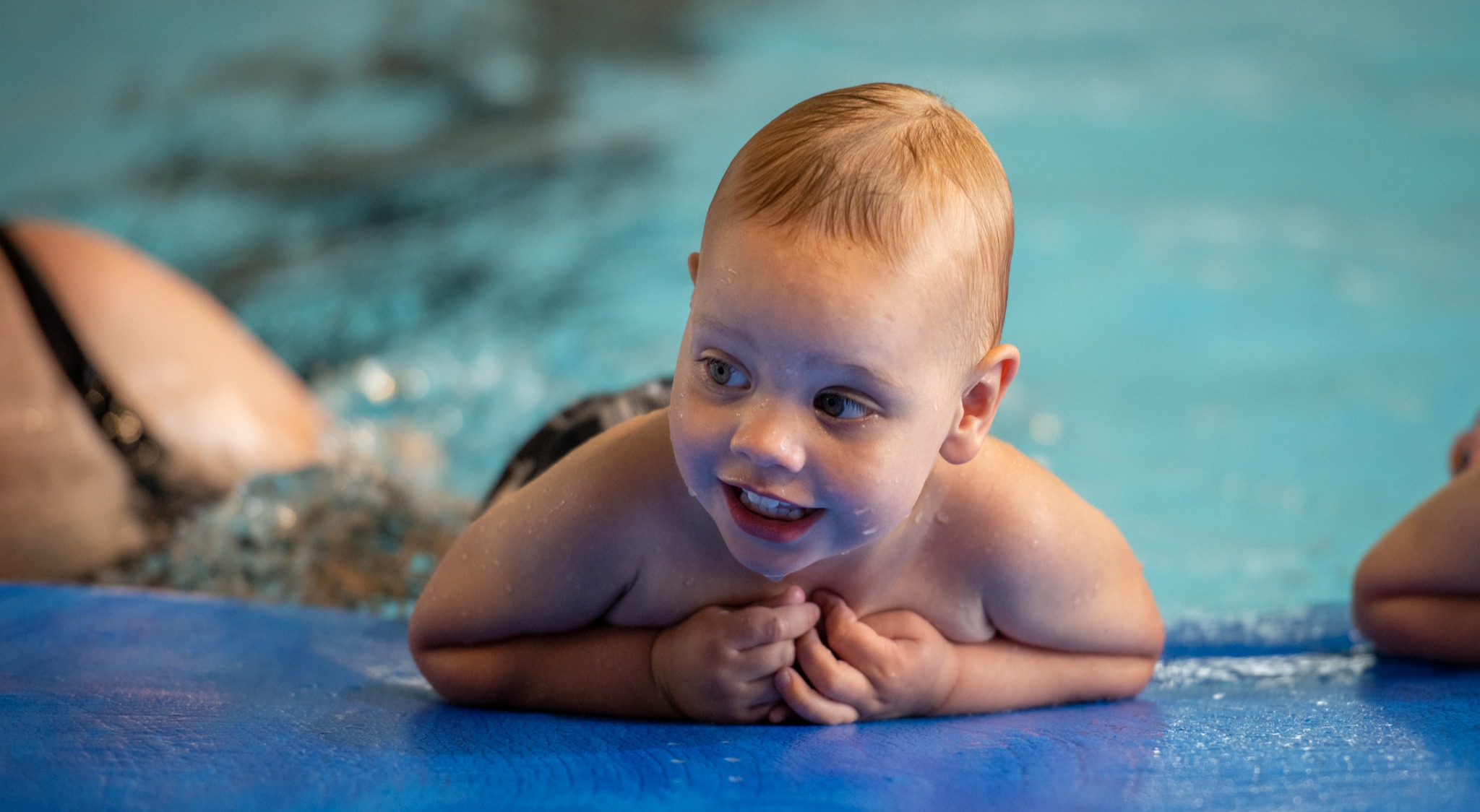 Baby on float kicking